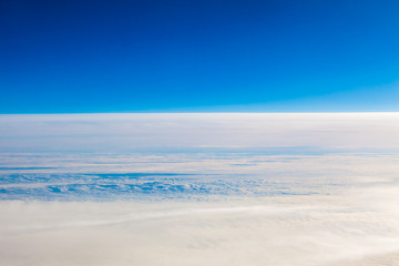 view from the window of an airplane.  Sky and clouds.