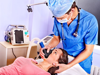 Patient wearing anesthesia mask at hospital.