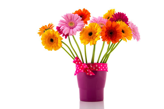 Purple vase with colorful flowers