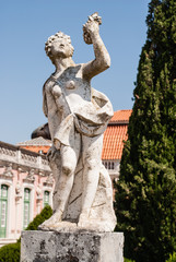 Fototapeta na wymiar Antique statue in park of Queluz