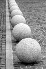Concrete balls urban adornments B&W image