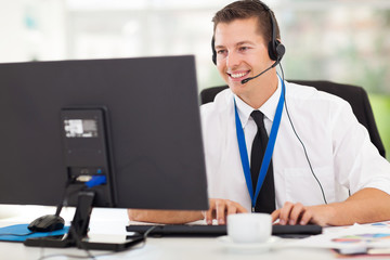 technical support operator working on computer