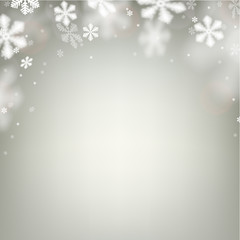 Christmas background with defocused snowflakes.