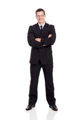 businessman in a suit with arms crossed