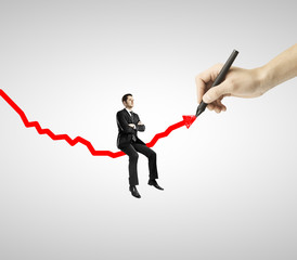 businessman sitting on arrow