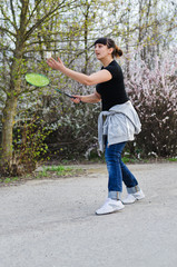 Fototapeta premium Woman playing badminton
