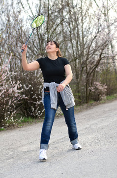 Fit Woman Playing Badminton