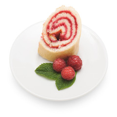 Sweet roll cake with raspberry jam and berries, isolated on a wh
