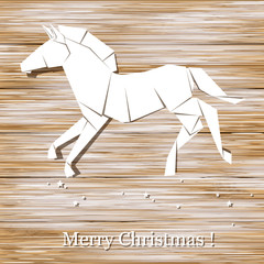 Horse origami made of paper on wood background.