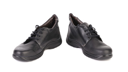 Black man's boots with white stitch.
