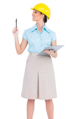 Cheerful attractive architect holding pen and clipboard