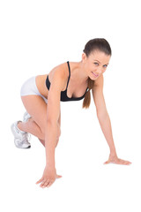 Fototapeta premium Smiling woman in sportswear preparing for race