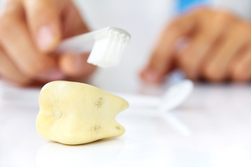 molar with dentist background, dental hygiene concept