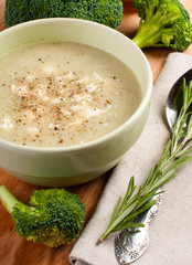 Broccoli cream soup with a sprig of rosemary