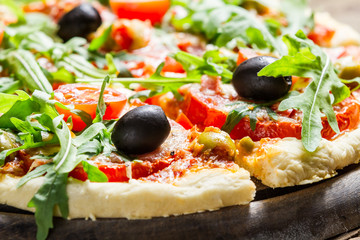 Closeup of fresh pizza with vegetables