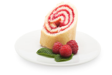 Sweet roll cake with raspberry jam and berries, isolated on a wh