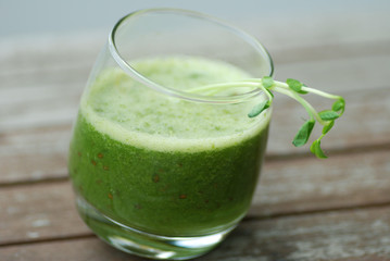 green healthy smoothie with pea shoots