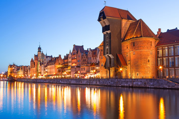 Fototapeta premium Old town of Gdansk with ancient crane at night, Poland