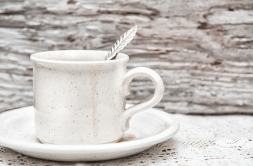 Cup of coffee on the lace napkin