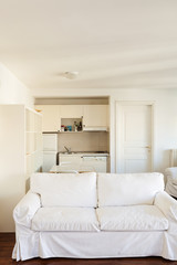 Interior, small apartment, room view, white divan