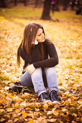 beautiful thoughtful girl  in autumn park
