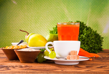 Breakfast including coffee,carrot,orange juice, muesli