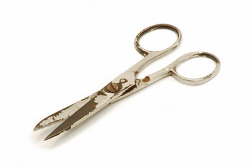 Old scissors isolated on white