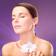 Naklejka premium relaxed woman with orhid flower