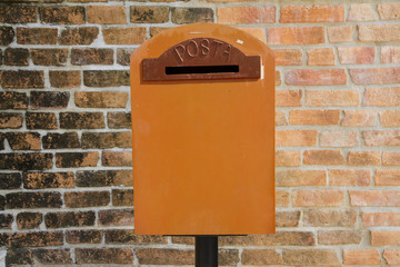 vintage mailbox on brick wall