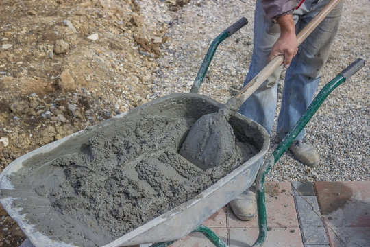 Worker With Concrete Mortar In Wheelbarrow 5