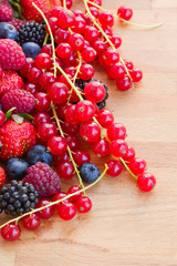 pile of fresh red berries on table