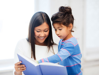 mother and daughter with book