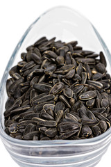 Black sunflower seeds in a bowl
