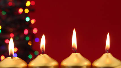Gold candles with christmas lights