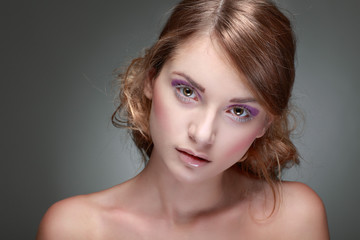 Naklejka premium portrait of sexy whiteheaded young woman on grey 