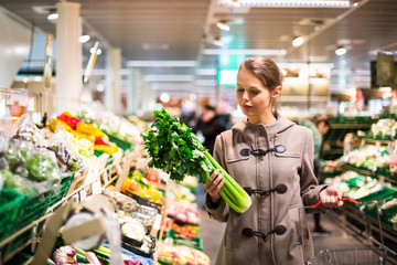 Pretty, young woman shopping for fruits and vegetables