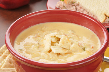 chicken con queso soup with a sandwich