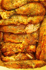 Closeup raw marinated chicken meat drumstick