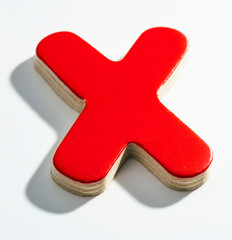 Shaded wooden red X on white base