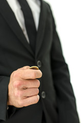 Detail of businessman tossing a coin.