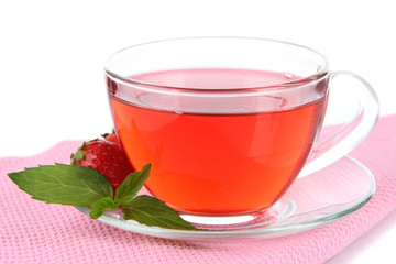Delicious strawberry tea on table on white background
