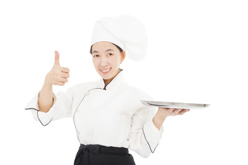 smiling young woman chef with thumb up