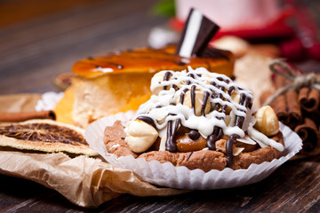 Coffee cakes with chocolate, spices and coffee seeds, close up