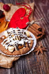 Coffee cakes with chocolate, spices and coffee seeds, close up