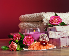 Obraz na płótnie Canvas Spa Settings with roses and salt in bowl , towel. Candle,soap on