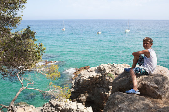 Young boy and beautiful Mediterranean seascape