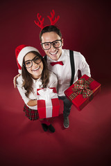 Portrait of funny couple with christmas presents