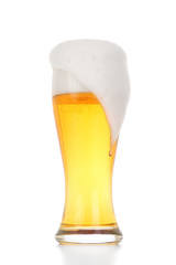 Glass of light beer isolated on white