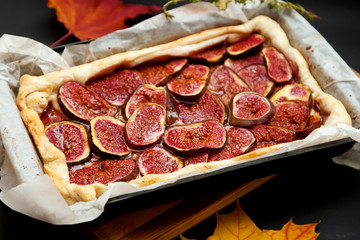 Homemade fig pie with brie cheese and honey