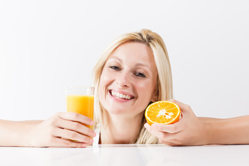 Healthy young woman with orange juice